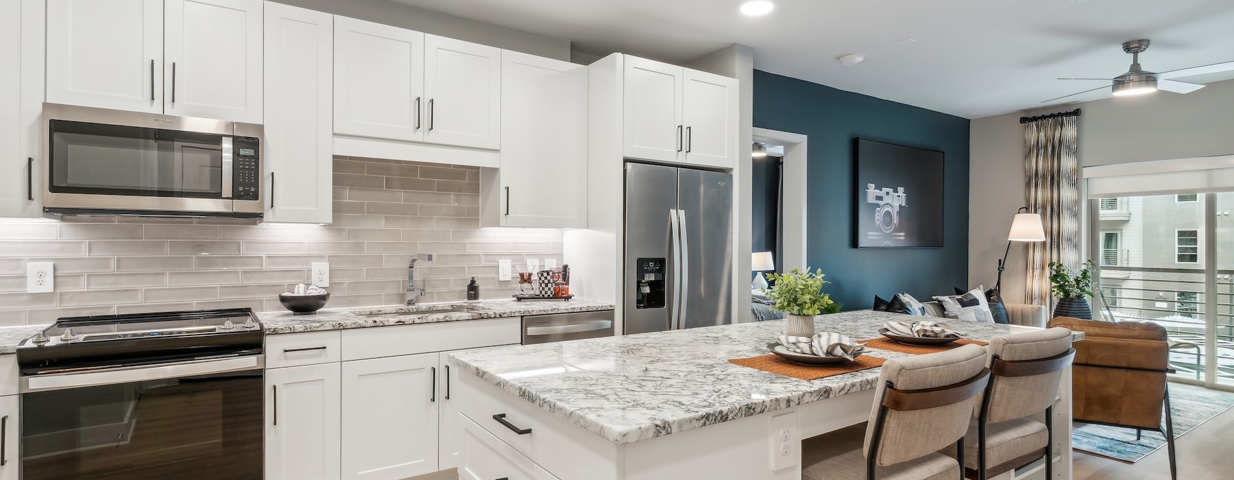 a kitchen with white cabinets