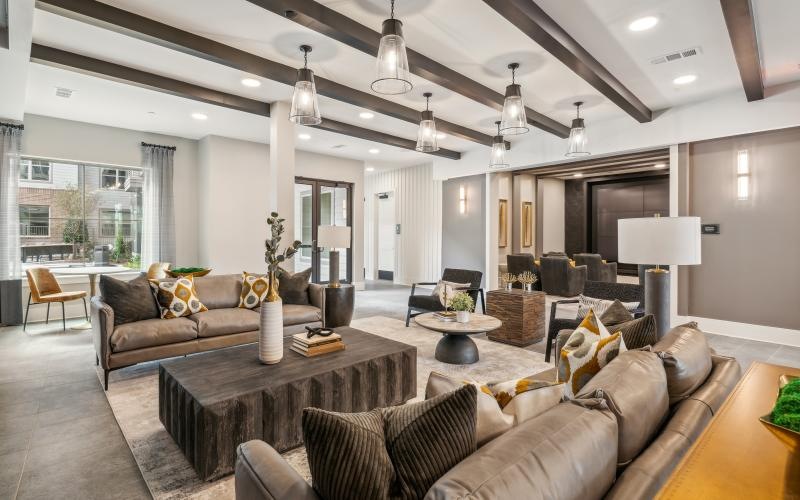 a clubroom with couches and tables