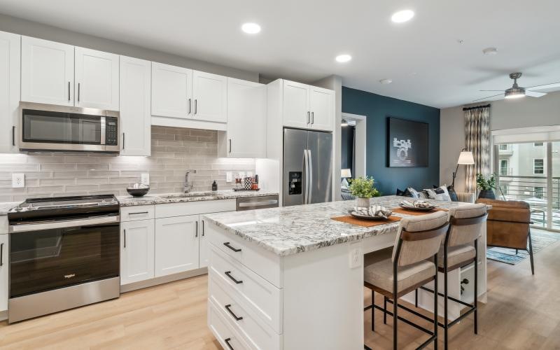a kitchen with white cabinets